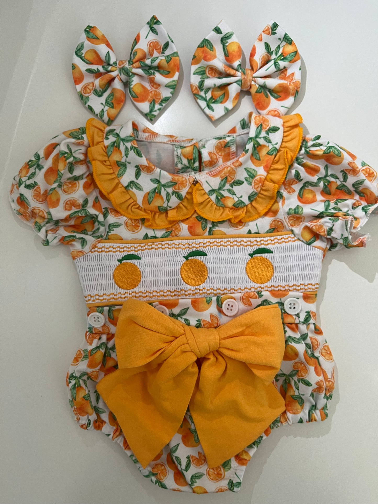 Orange romper with bows